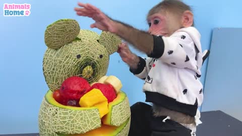 naughty monkey help dad to decorate the fruits