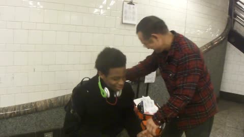 Luodong Briefly Massages Black Man In Subway Station