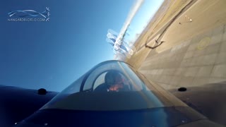Cockpit view captures stunt plane's amazing low altitude cross
