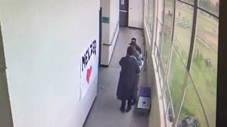 High school coach disarms student with a hug