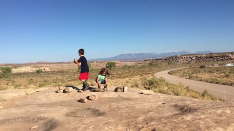 Kids throwing rocks in Moab, UT!