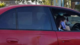Driver Laughs When Caught on Her Phone