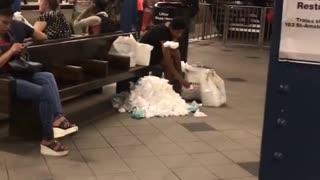 Woman subway station wasting tissue mountain wiping feet