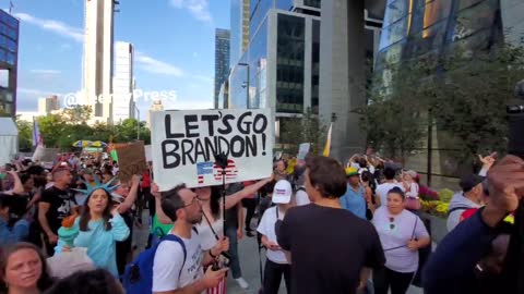 "Let's go Brandon" sign being displayed as the crowd chants that CNN sucks!