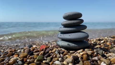 Tranquil Rock Balancing by the Lake: Harmony, Relaxation, and Serenity in Nature's Embrace