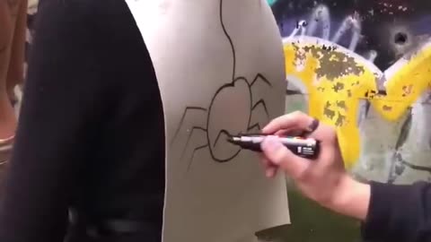 Guess what he is painting?