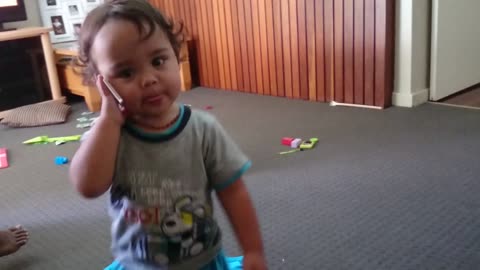 Funny baby on phone