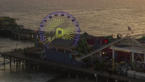 Amusement park in the beach at sunset