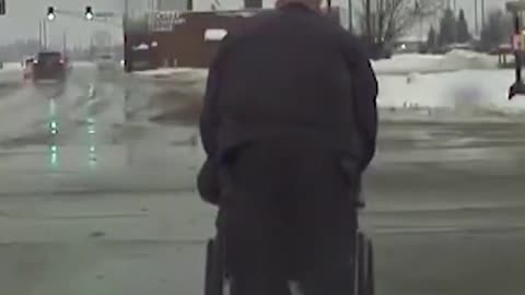 Heartwarming video shows moment Indiana officer helps wheelchair user cross busy intersection
