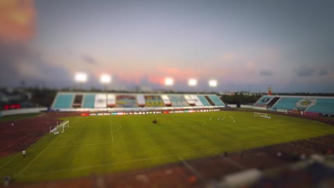 Time Lapse Video of Soccer Players Warming Up and Playing Football in Soccer Field.