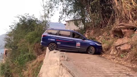 The driving expert demonstrates the very narrow road U-turn skills