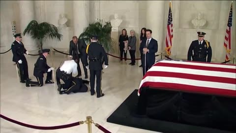 Honor Guard collapses as Justice Sandra Day O'Connor lies in repose in court's Great Hall