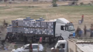 Video shows humanitarian trucks stolen by Hamas, looted by civilians after they enter Gaza