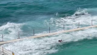 Wave Hits Swimming Pool