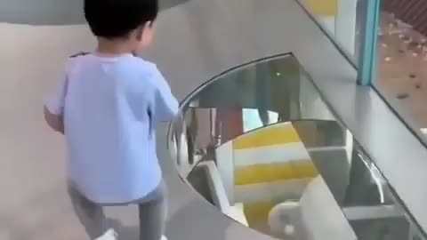 Toddler afraid to cross from glass bridge😅