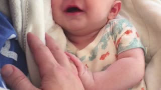 Cute baby talking to Dad