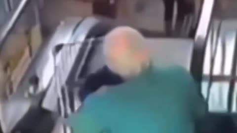 Old lady having trips at an escalator