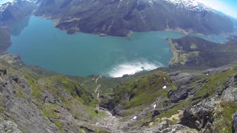 Epic wingsuit flight over breathtaking landscape