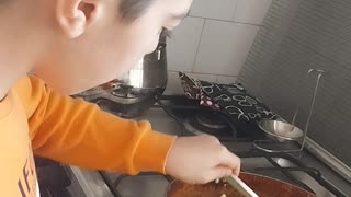 My son cooking