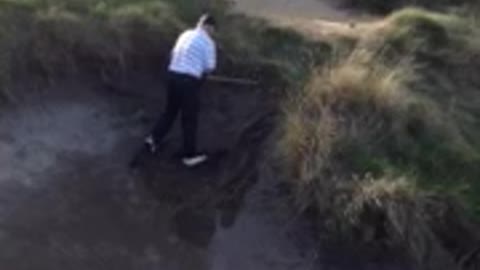 Golfer Takes A Tumble In The Trap