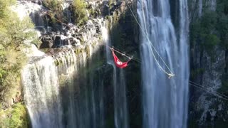 An extreme way to lie in a hammock is right above the cascading streams