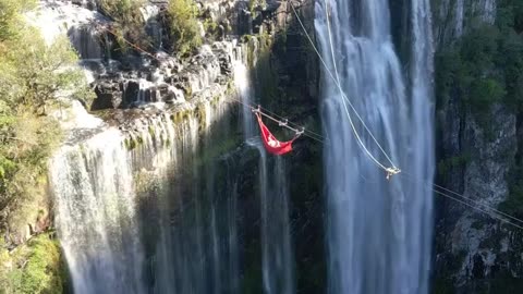 An extreme way to lie in a hammock is right above the cascading streams