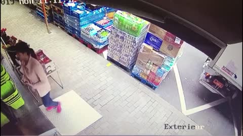 Truck Runs Over Boxes Of Merchandise In Front Of A Store And Crashes Them