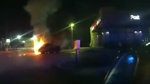 Police rescue woman from burning car