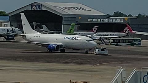 Boeing 737-400F PR-SDF towed for cargo terminal of Manaus International Airport