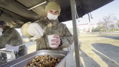 Servicemen Bake Bread And Prepare Hot Soup For Affected Citizens