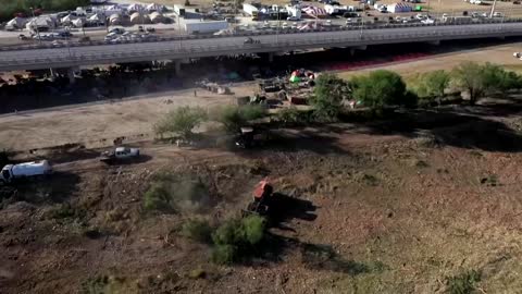 Drone shows U.S. reducing size of Texas border migrant camp