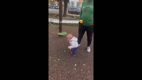Mom unintentionally records the infant's first steps on camera.