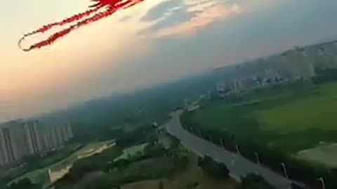 A man made a phoenix kite controlled by a drone and flew it in the sky.