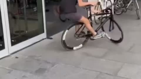 street guy playing with bike