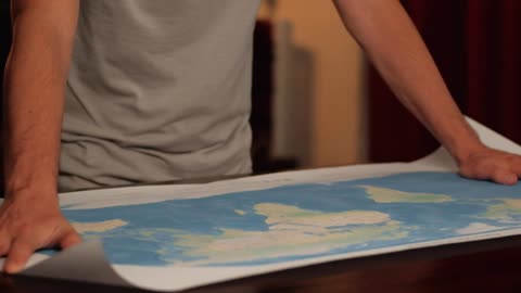 Unrolling a world map on a table