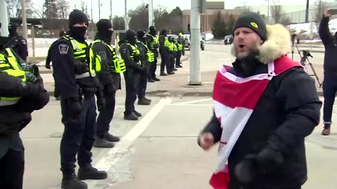 Canada police begin clearing protesters blocking bridge