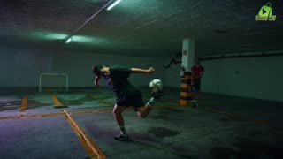 Talented freestyle soccer player doing tricks with the ball