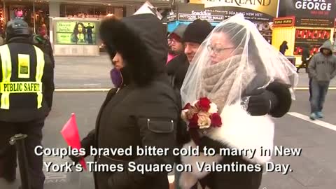 Couples tie cold knots from Times Square