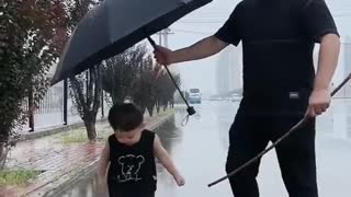 funny cute kid in rain