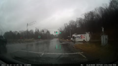 Fedex truck runs light cutting off car