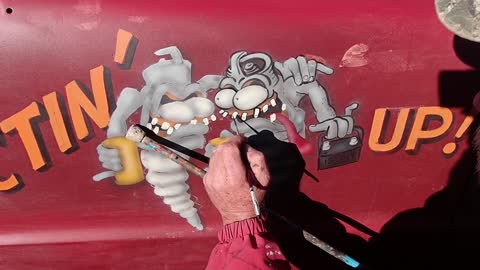 Sparkplug Monsters Come to Life on the Door of a Pickup Truck