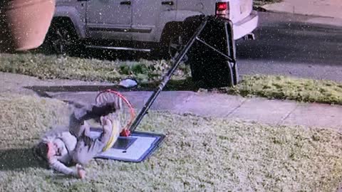 Woman Crawls Through Fallen Basketball Hoop