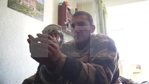 Footage of a survey of captured Ukrainian servicemen who hid in residential buildings