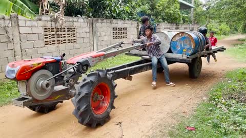 #79-driver tractor go transport water at the river