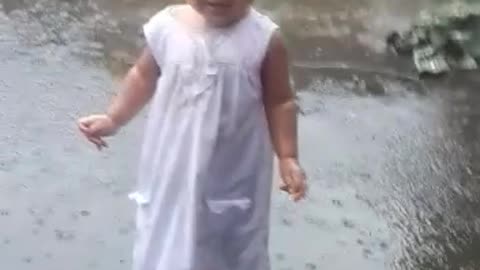 Baby enjoying 🌧 rain