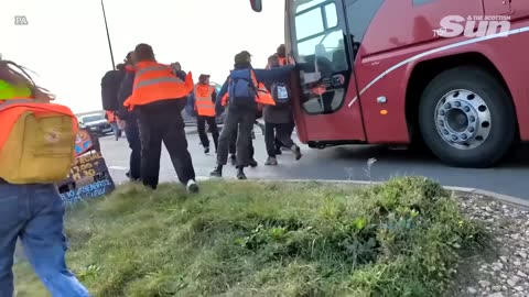 Bus driver rams Just Stop Oil protesters blockade nearly running them over