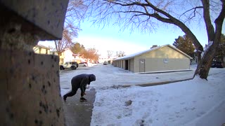 Man Slips and Falls on Icy Walkway