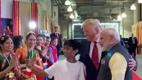 PM Modi & president trump with a group of youngsters at during #howdyModi event