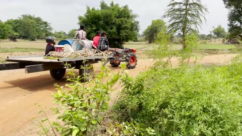 #79-driver tractor go transport water at the river