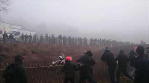 Motocross rider crashes through fence into crowd